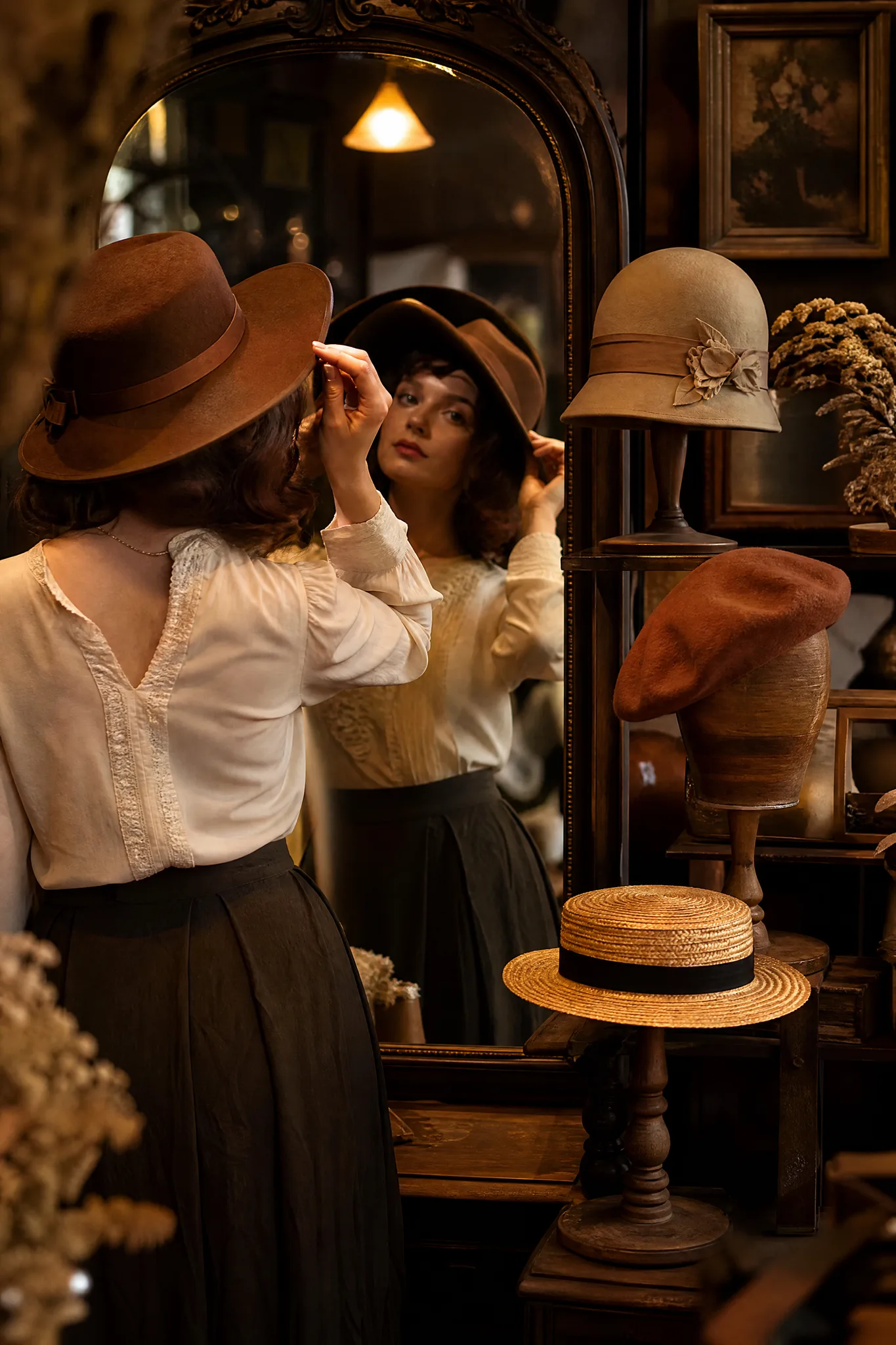 Grok Imagine Image: Comparing Directions Woman trying on a wide-brimmed hat at a mirror in a milliner's studio with other hat styles behind