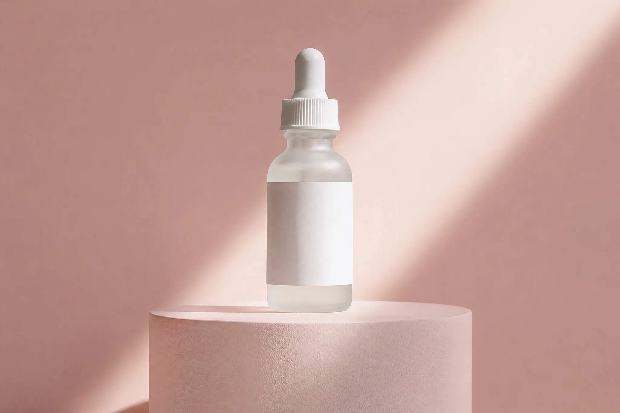 Frosted glass serum dropper bottle on a pale pink plinth with a diagonal beam of light