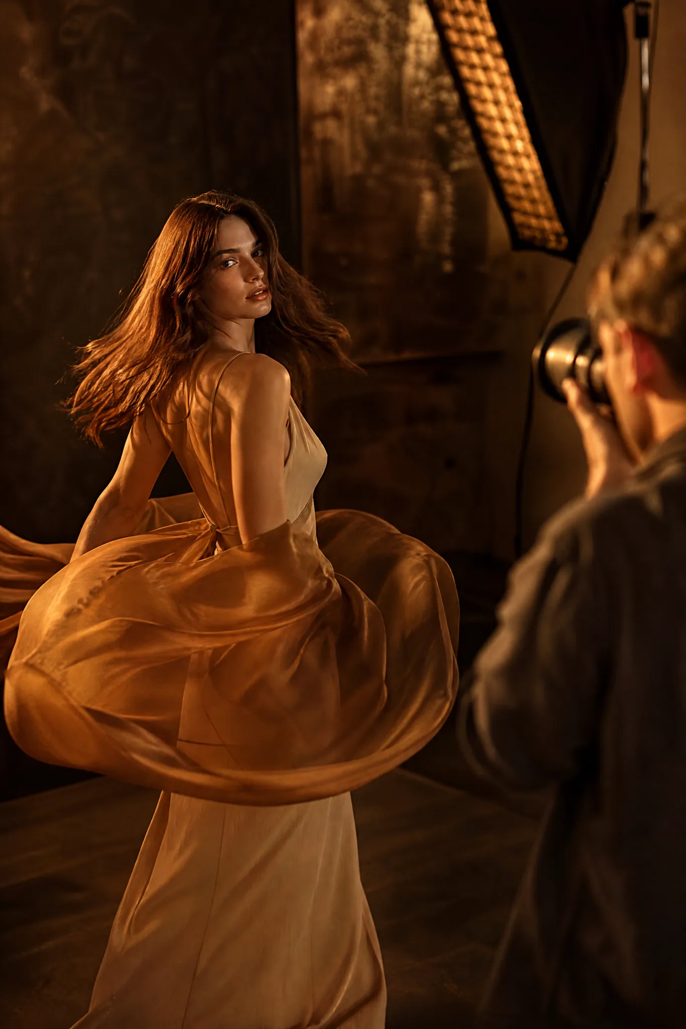 Z-Image Turbo: Exploring Separate Takes Model mid-turn in swirling amber silk as a photographer shoots another take